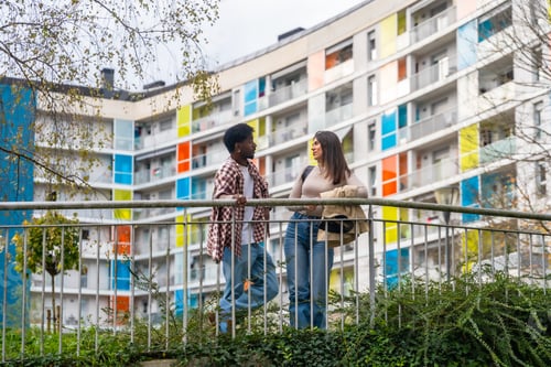 Preview: Diverse friends talking outdoors on a city bridge