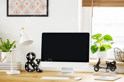 Preview: White lamp next to desktop computer on wooden desk in home offic
