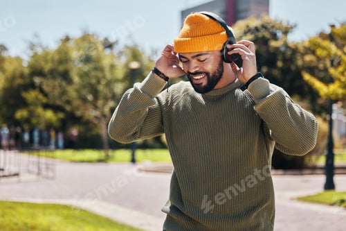 Preview: Music, headphones and happy man at park outdoor, listening to audio online and hearing sound track