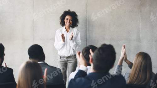 Preview: Business presentation. Grateful audience clapping hands to speaker