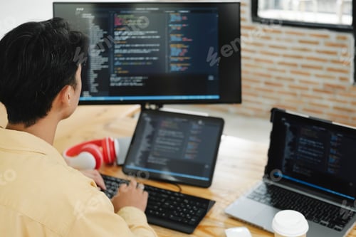 Preview: IT Programmer Starts Working on Desktop Computer.