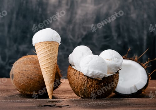 Preview: Fresh sweet coconut ice cream in a coconut shell on a wooden table. Sweet summer food.