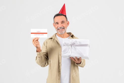 Preview: Senior man with gift certificate and present