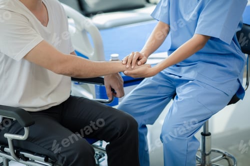 Preview: Male patient sitting in wheelchair undergoing a medical examination with specialist physician, treat