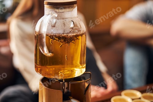 Preview: Glass teapot with tea on portable gas burner