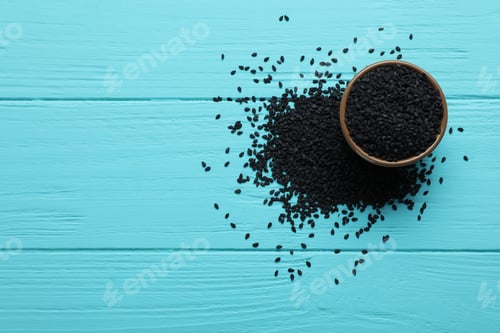 Preview: Bowl and black sesame on turquoise wooden table, flat lay. Space for text