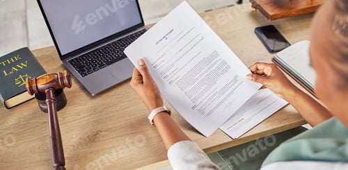 Preview: Woman, hands and lawyer reading documents for court, judge or justice on office desk above. Female