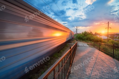 Preview: High speed train in motion on the railway station at sunset
