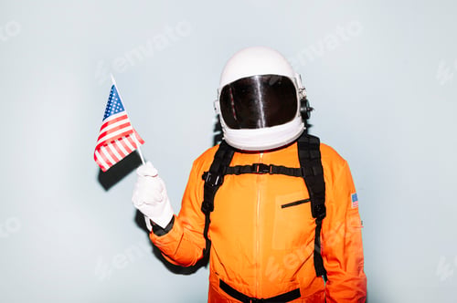Preview: Man with astronaut helmet showing United States flag