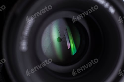 Preview: Camera lens close-up on white background