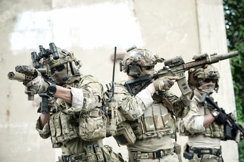 Preview: Soldier in full US MARSOC armed with assault rifle run through the abandoned building. Military
