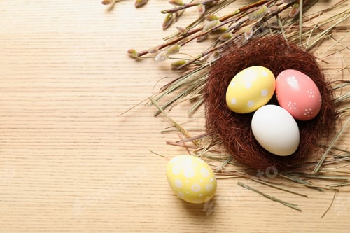 Preview: Flat lay composition with painted Easter eggs on wooden table, space for text