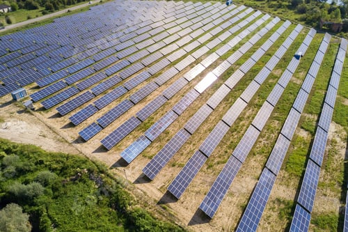 Preview: Aerial view of solar power plant on green field