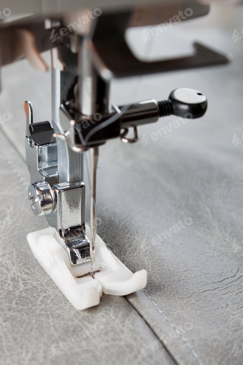 Preview: Modern sewing machine presser foot and item of clothing