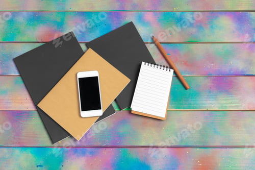 Preview: smartphone, tablet, notebook pen on the background of a wooden table