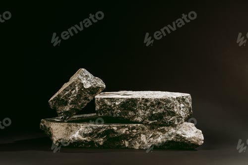 Preview: Pieces of granite stone on black background studio shot