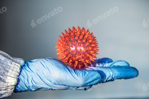 Preview: Virus Model on Blue Gloved Hand Close Up