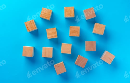 Preview: Top view of wooden toy blocks on blue
