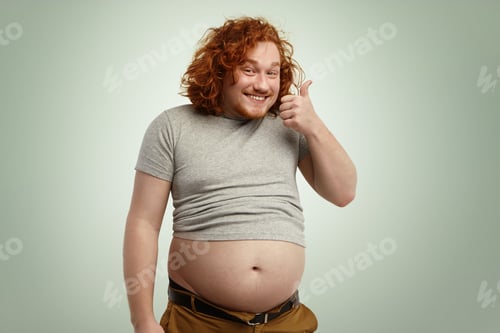 Preview: People, nutrition, body shape and healthy lifestyle concept. Happy young plump chubby man with curly