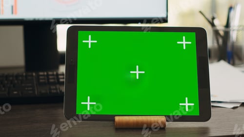 Preview: Empty desk with greenscreen on tablet