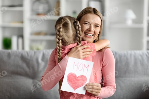 Preview: Mother's Day Present. Happy Woman Holding Handmade Greeting Card And Hugging Daughter
