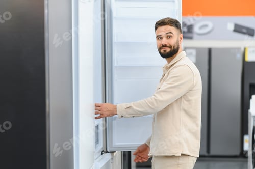Preview: Customer choosing new refrigerator in electronics store