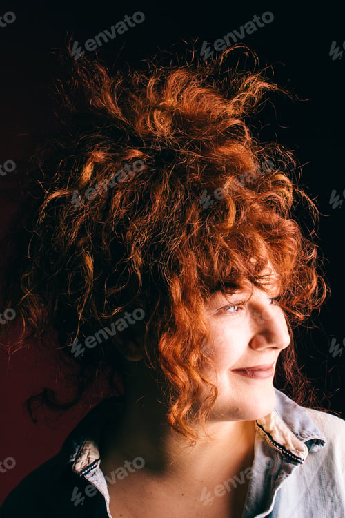 Preview: Portrait Of A Beautiful Girl With Curly Red Hair