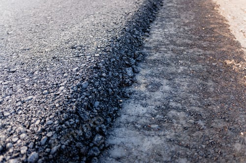 Preview: Detail of the edge of a freshly paved road.