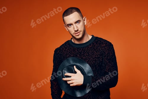 Preview: man in black sweater with hat fashion studio modern style