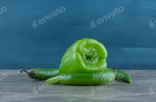 Preview: Sweet and hot peppers , on the marble background