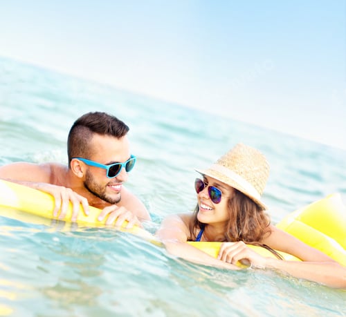 Preview: Young couple having fun in the sea
