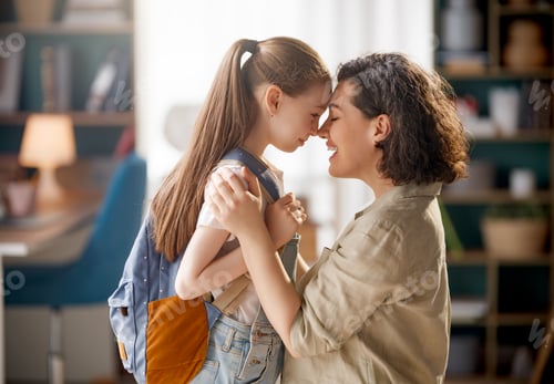 Preview: Happy Mother and Daughter Sharing Loving Moment Before School at Home