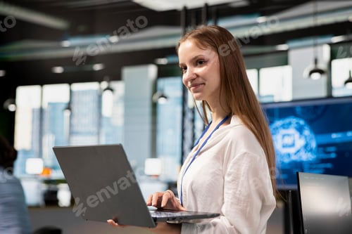 Preview: Smiling junior developer utilizing artificial intelligence to optimize performance