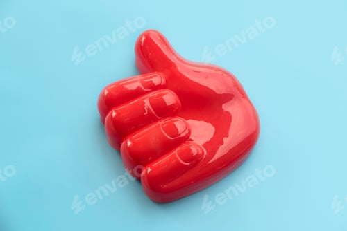 Preview: Red Thumbs Up Hand Gesture on Light Blue Background.