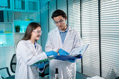 Preview: Asian male and female scientis work together in the research laboratory.