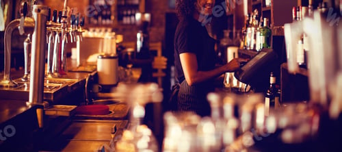 Preview: Young waiter using a electronic machine