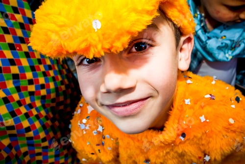 Preview: Cheerful children male smiling and having fun doing carnival celebration