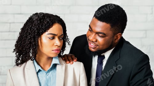 Preview: Sexual harassment in office. Male boss touching his disgusted female subordinate at workplace