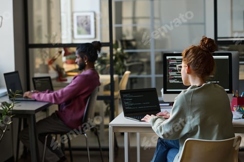 Preview: Young programmers working on computers