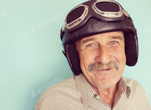 Preview: Senior Funny Man As A Pilot With Hat And Glasses