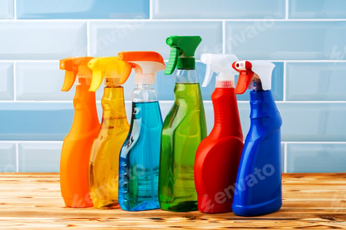 Preview: Household detergents and cleaning tools against blue tile background
