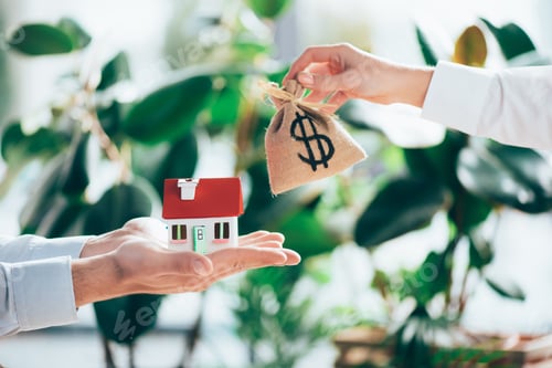 Preview: partial view of people exchanging sackcloth bag with dollar sign and house model