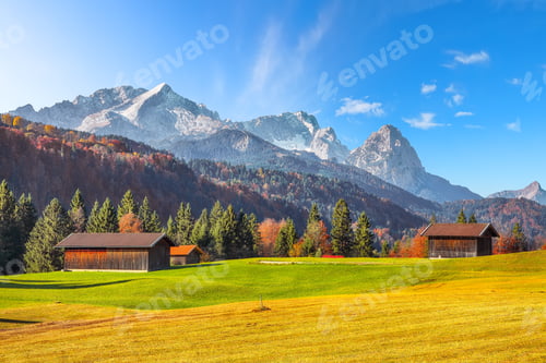 Preview: Amazing view of alpine meadow with wooden huts near Wagenbruchsee (Geroldsee) lake
