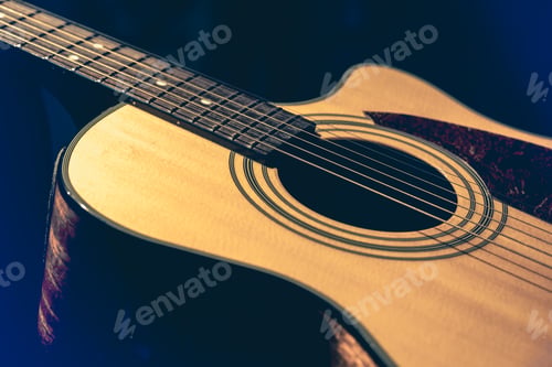 Preview: Musical background with acoustic guitar close up.