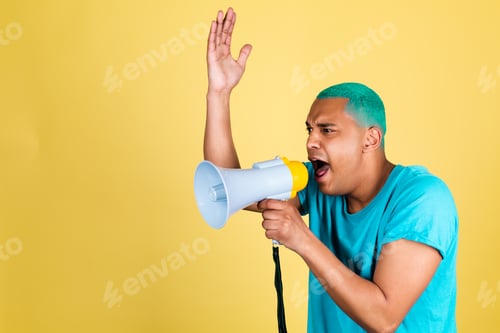 Preview: Black african man in casual on yellow background blue hair screaming shouting in megaphone to left