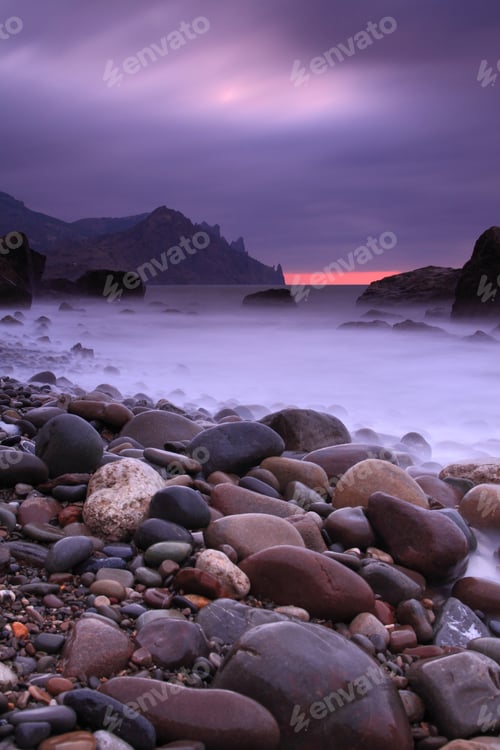 Preview: Sunset on the rocky shore of tropical sea