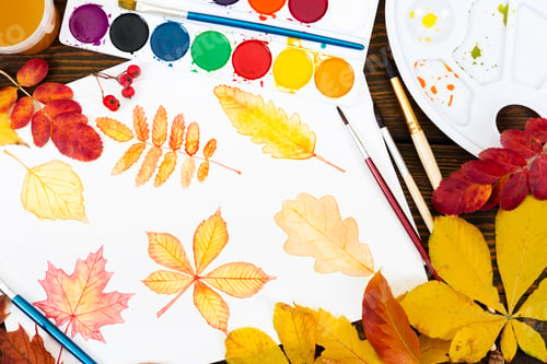 Preview: Drawing with watercolor autumn leaves on wooden background. Top