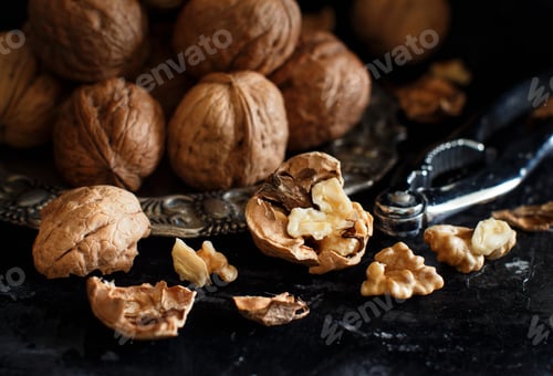 Preview: Fresh walnuts on a dark background