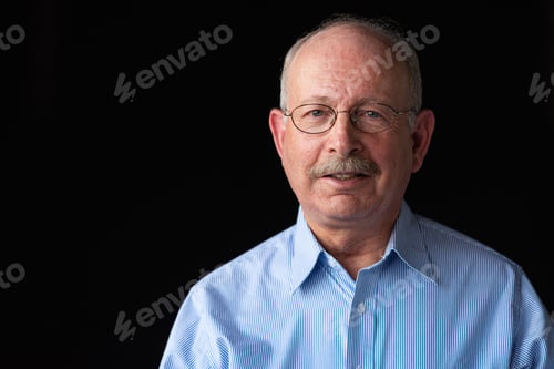 Preview: Grey haired senior man with mustache wearing eyeglasses