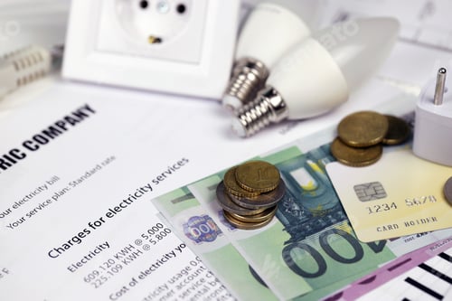 Preview: Calculator and Euro bills with pen on european electricity bill